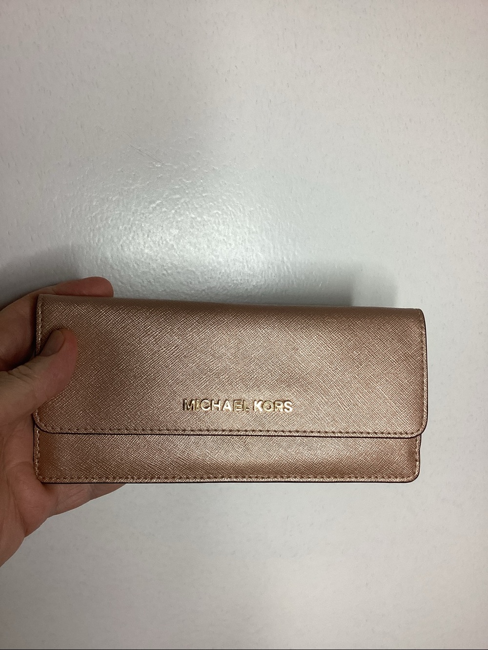 M. Kors rose gold saffiano flap wallet. Preloved item sold as is